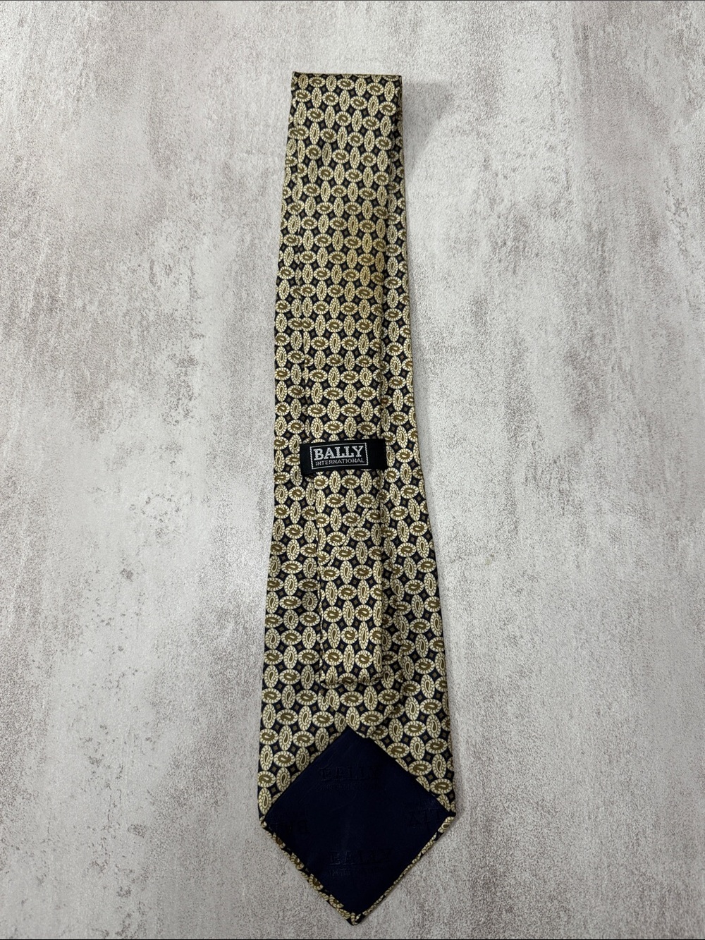 Bally Black Tie with Gold Medallion Pattern